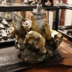 bronze statue of a mama bear and her three cubs