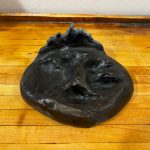 bronze wolf print art piece