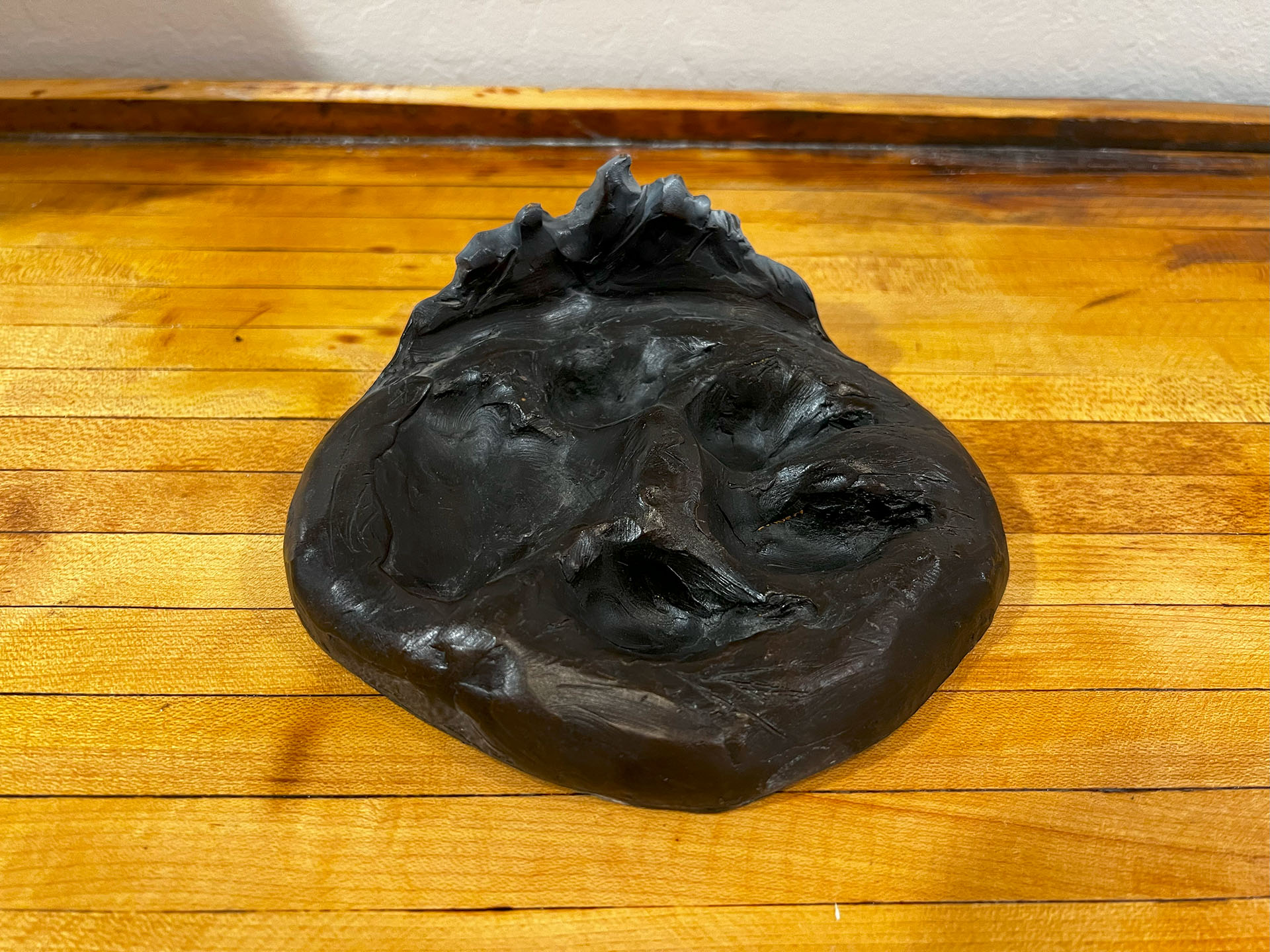 bronze wolf print art piece